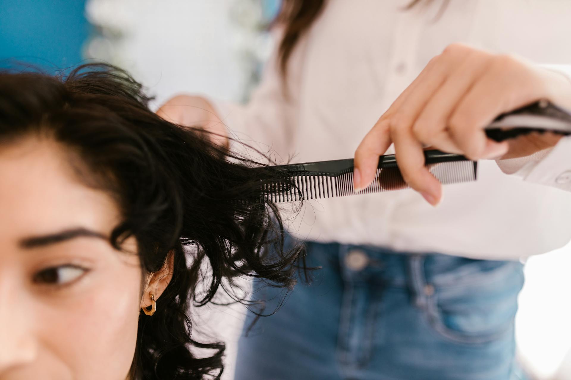 woman getting haircut in salon